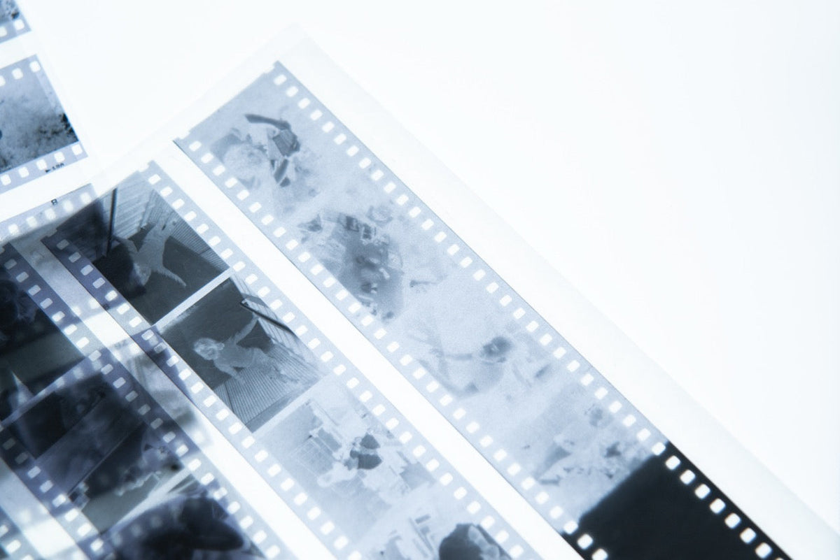 Black-and-white negative strips on a light table