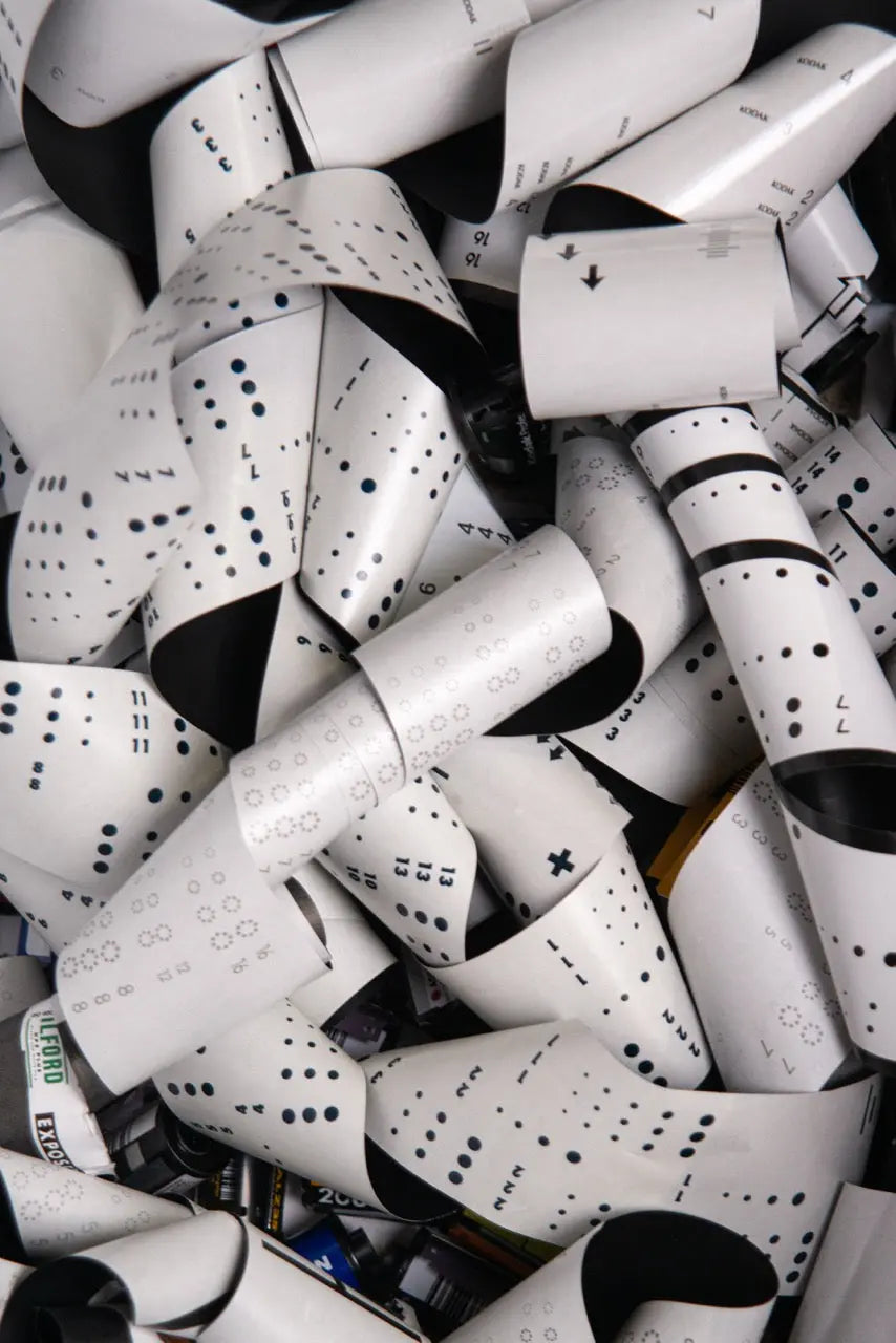 Coils of clear film with visible perforations