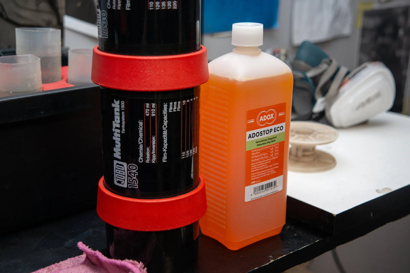 Black and white film chemistry prepared beside a developing tank