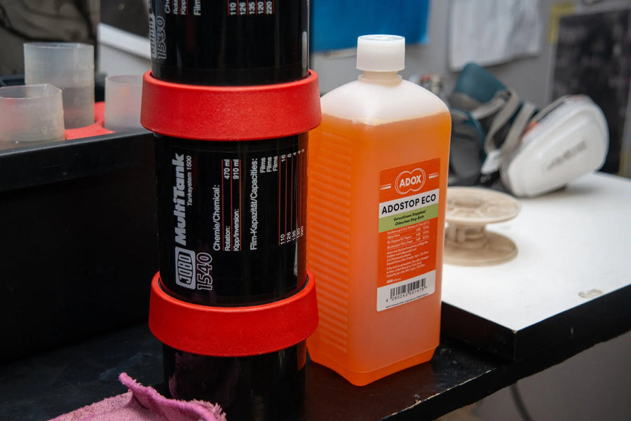 Black and white film chemistry prepared beside a developing tank