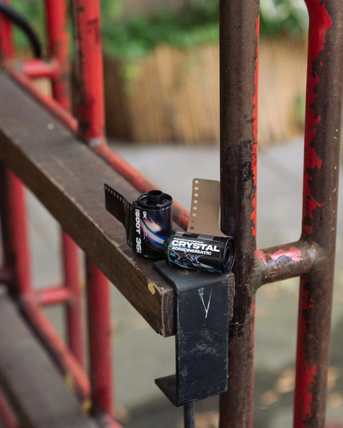 Film rolls on a sunlit outdoor bench