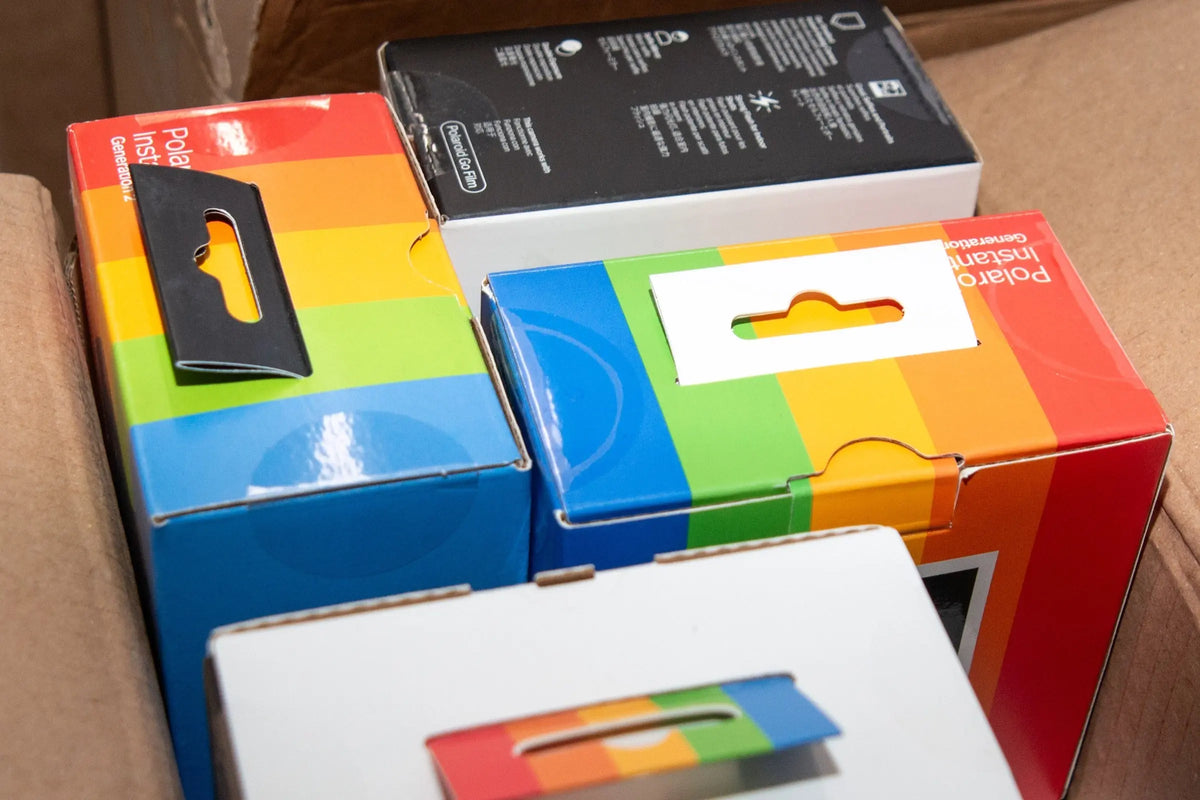 Boxed instant film packs arranged on a table