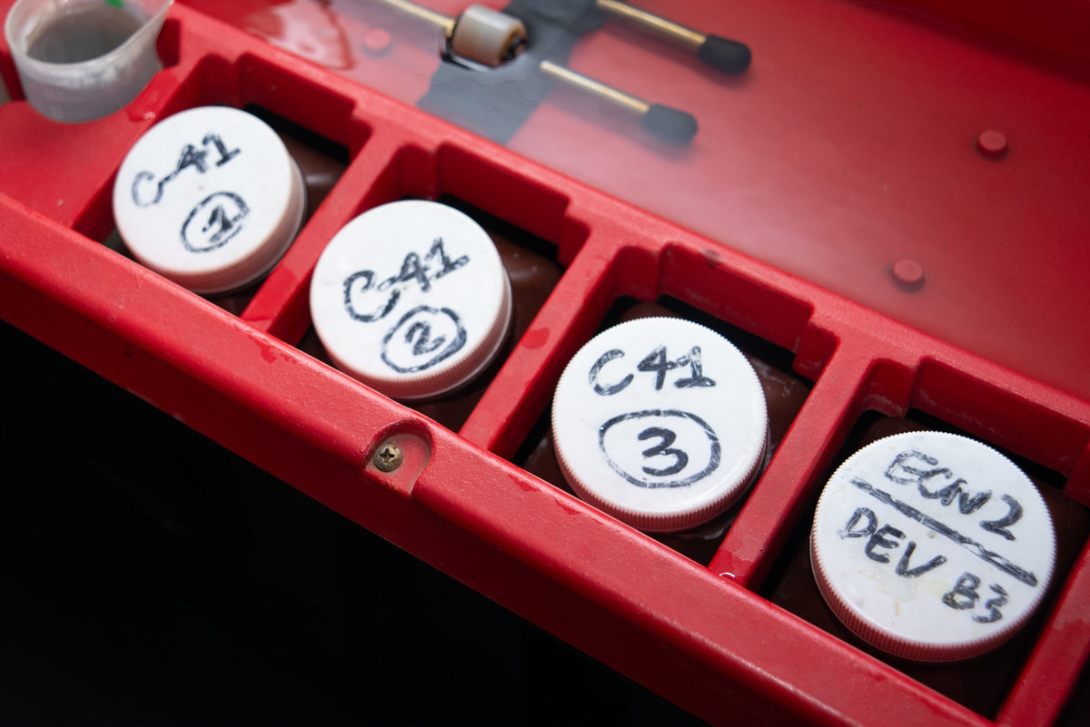 Labelled C-41 and ECN-2 chemistry bottles in the laboratory