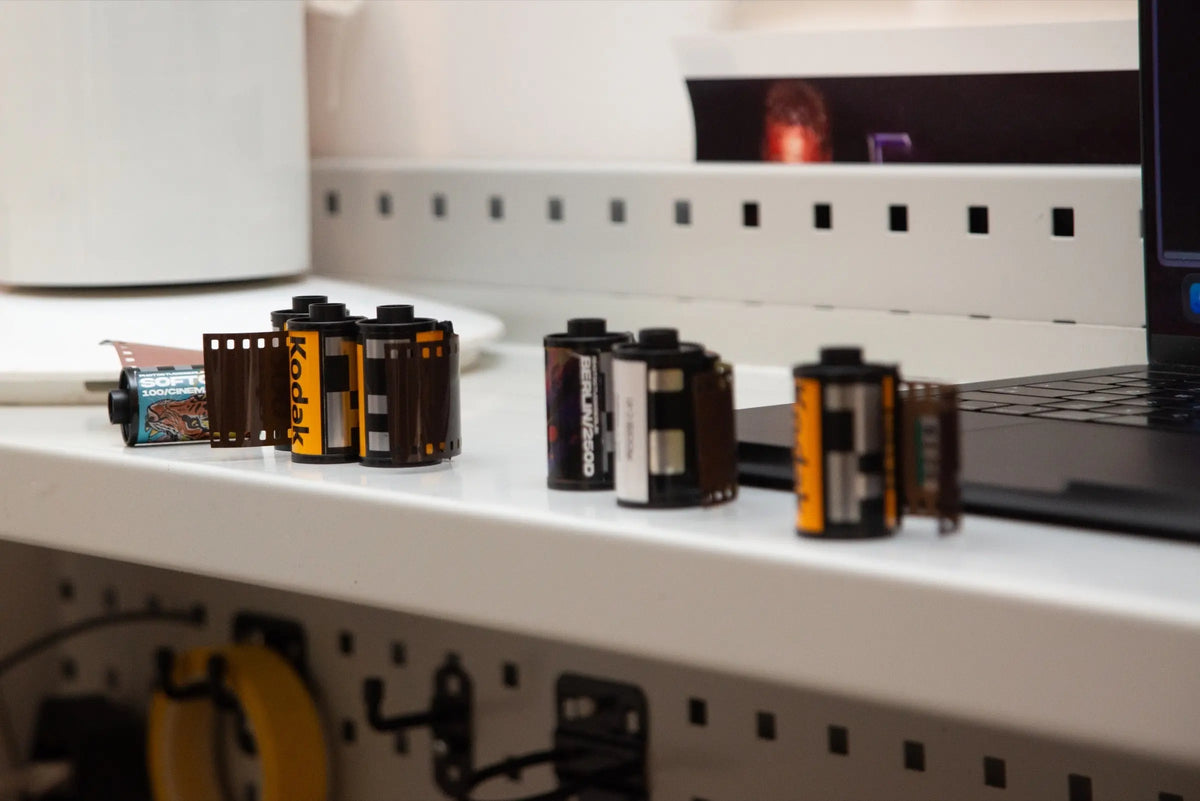 Film rolls queued on a shelf at Berlin Photo Studio