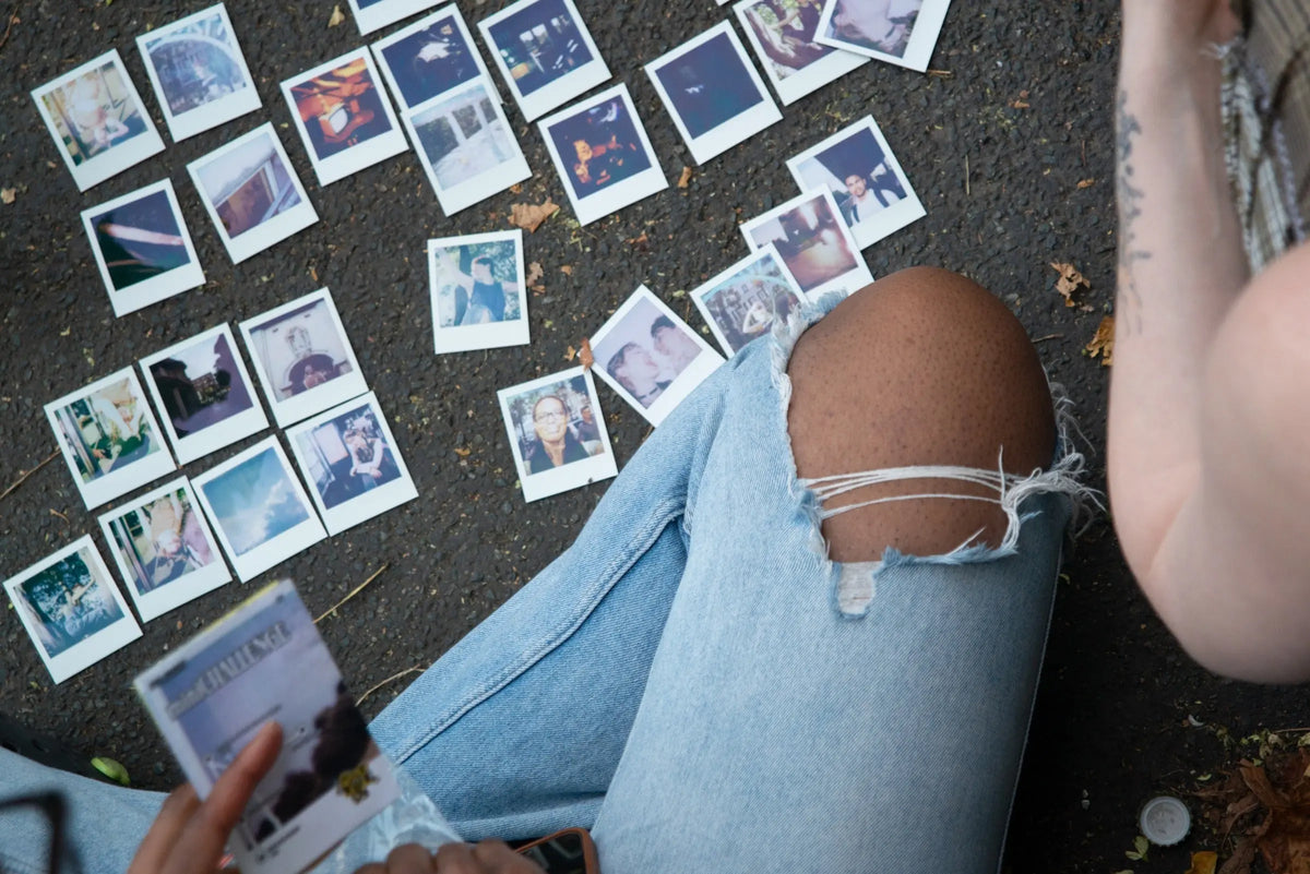 Instant photographs arranged for review after a photo walk