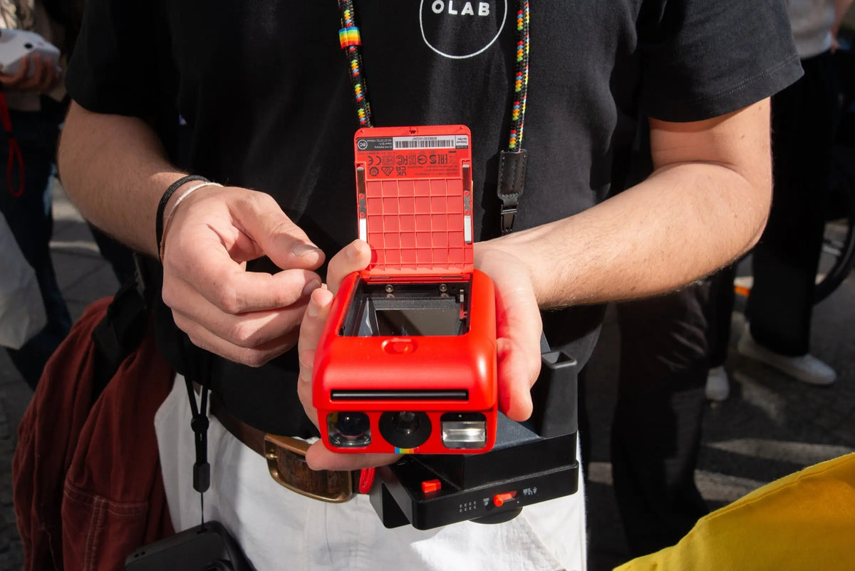 Instant camera film compartment opened for inspection