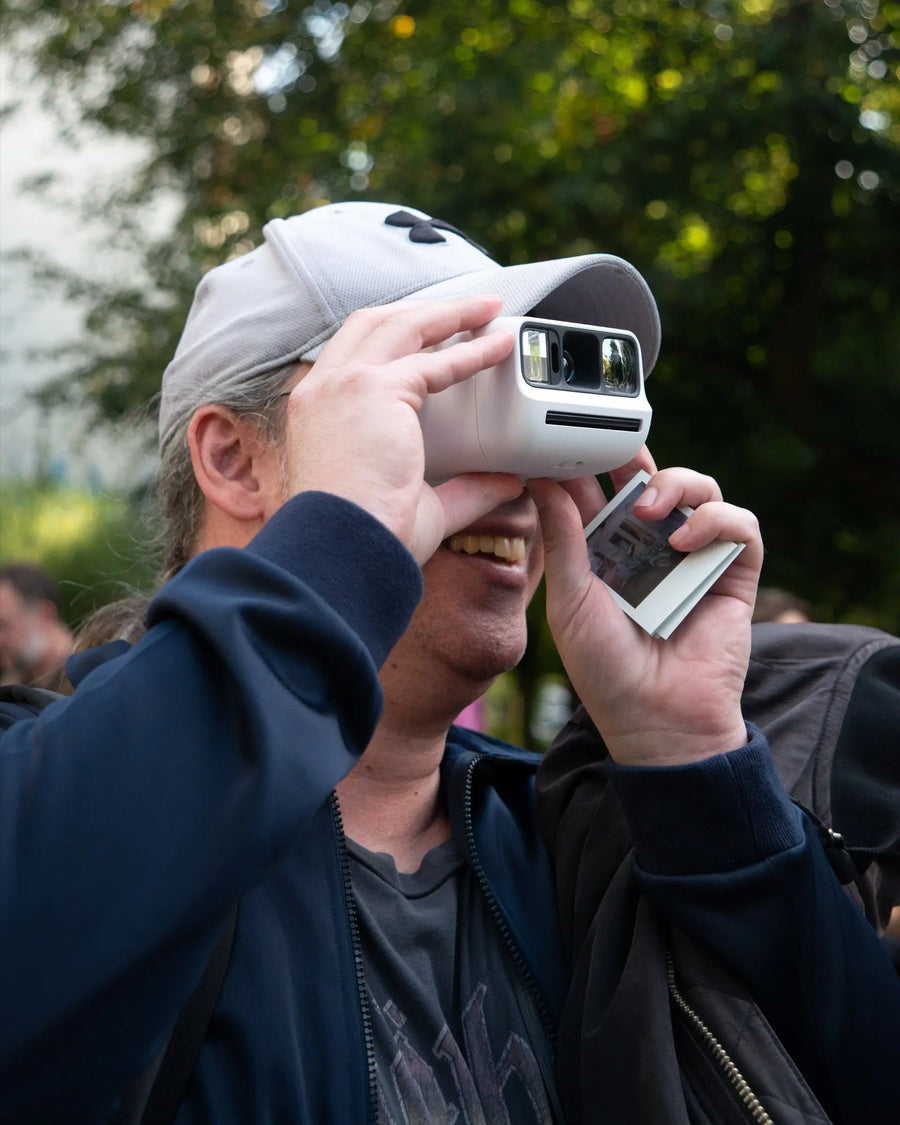 Participant taking a photograph during a Polawalk