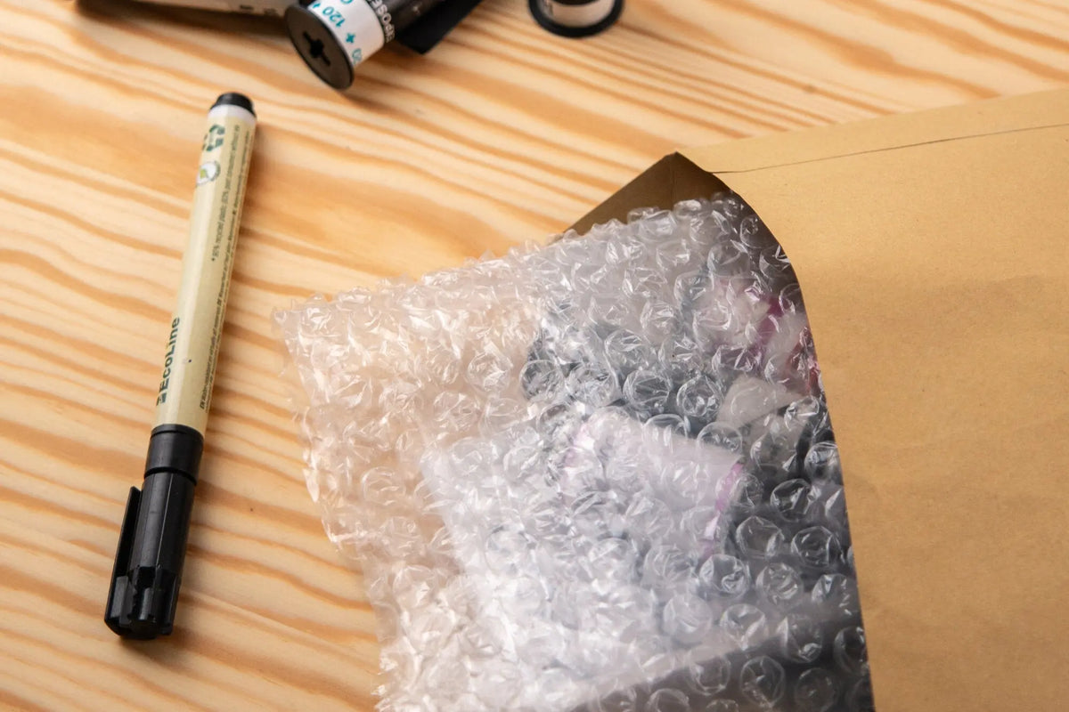 Protective bubble wrap and padded envelope for mailing film