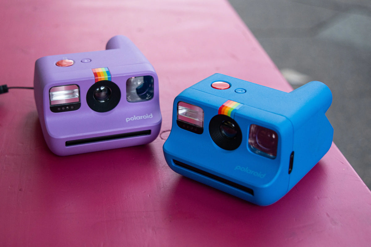 Two colourful Polaroid Go instant cameras in Berlin