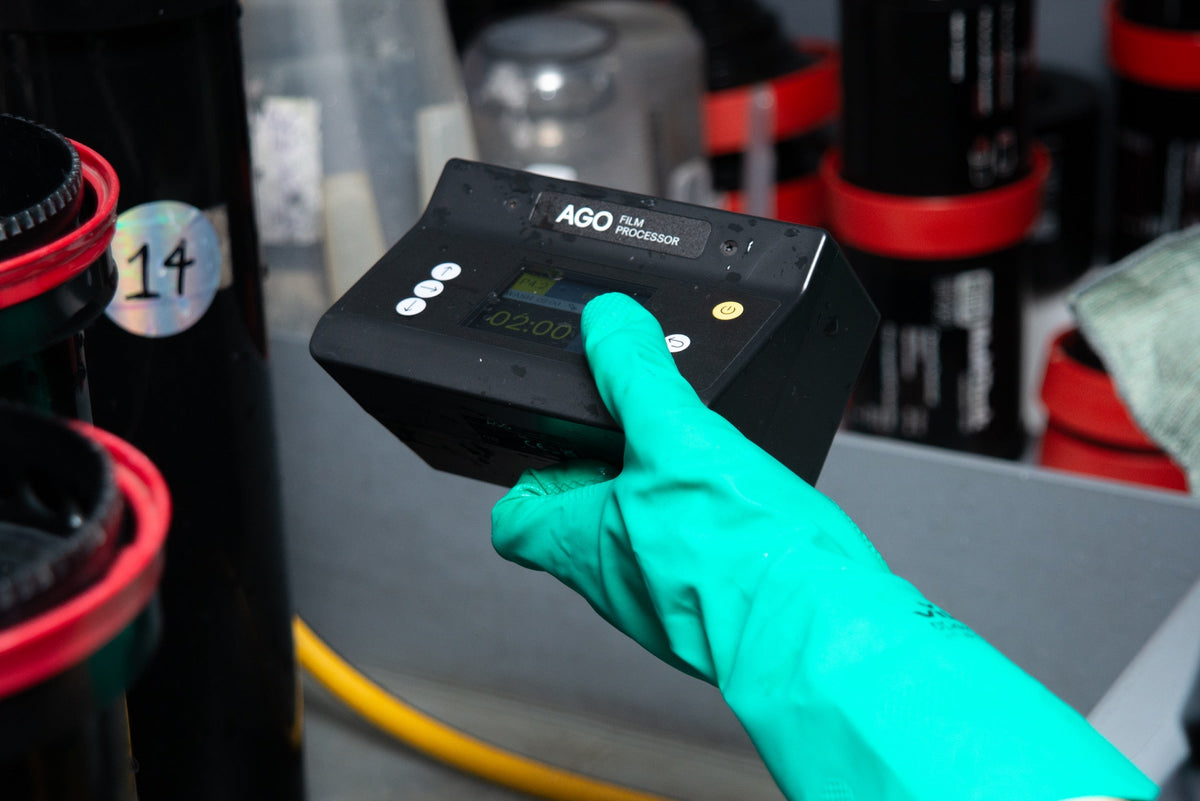 Technician adjusting a film processing controller