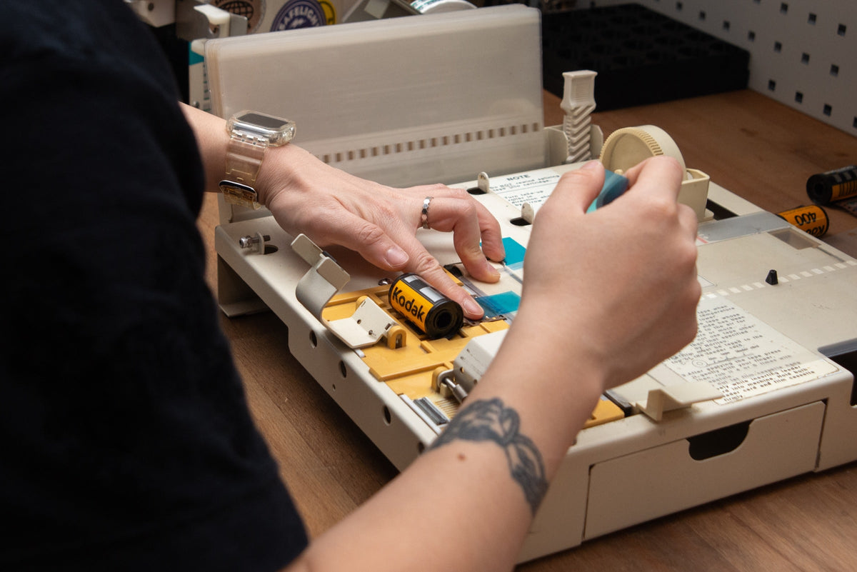 Technician preparing film for processing