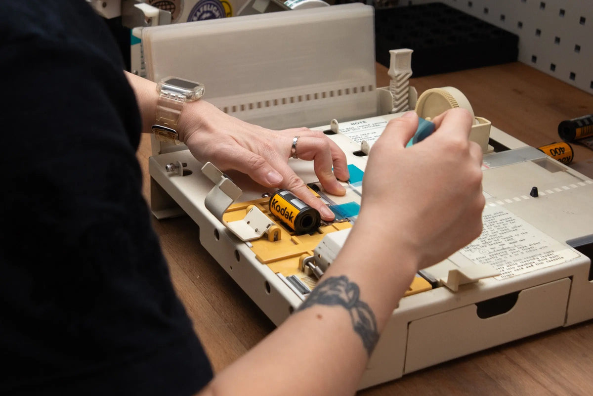 Technician preparing film for processing