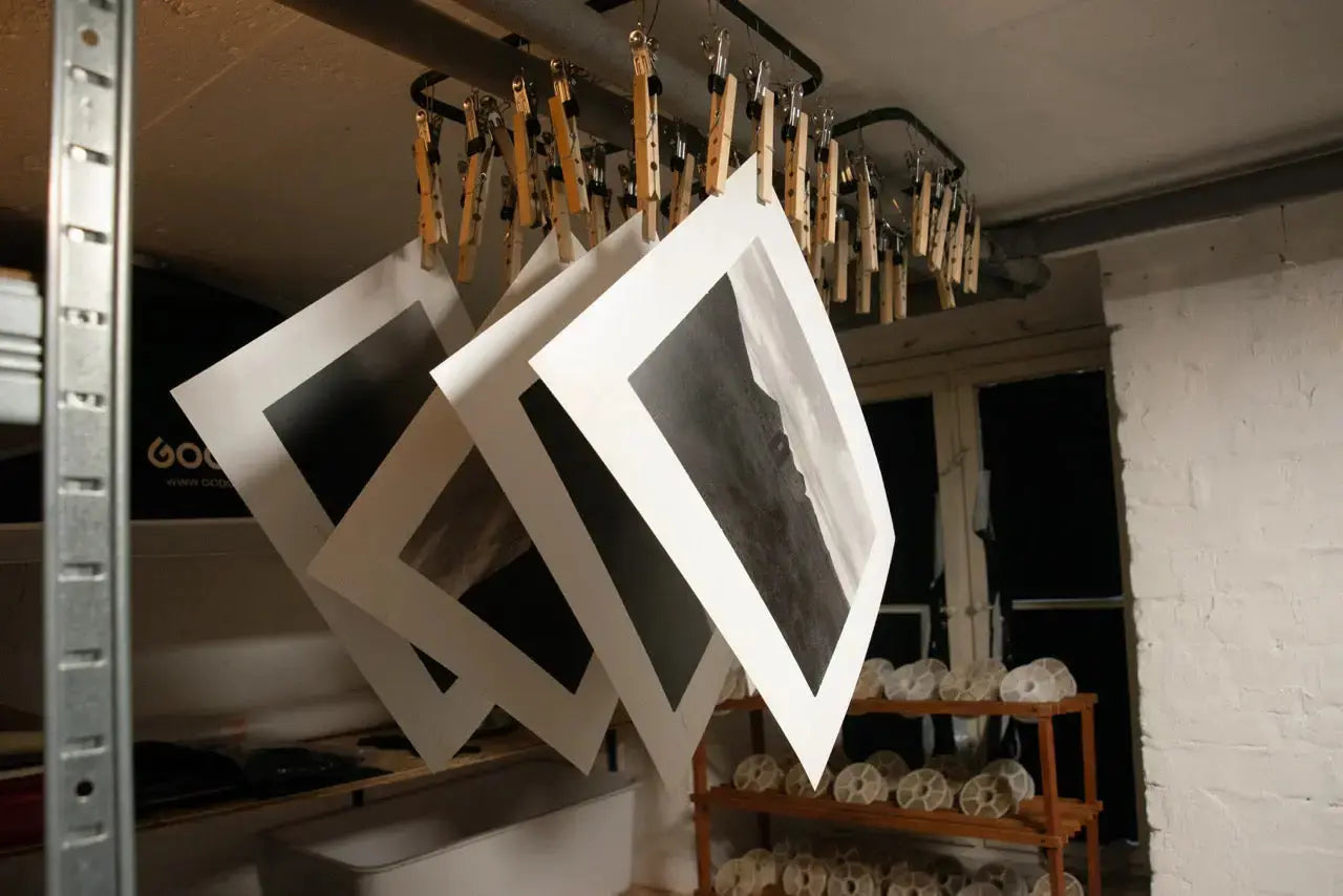Essential analog darkroom equipment and supplies for developing film and creating traditional black and white prints.