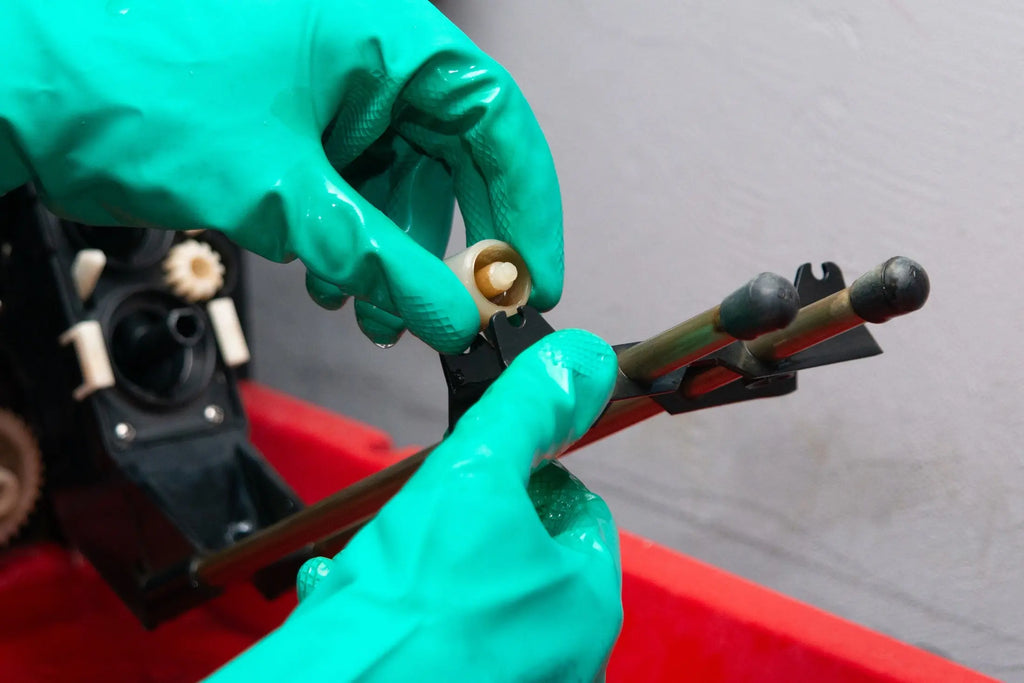 Close-up of the tank support rollers being adjusted at Berlin Photo Studio