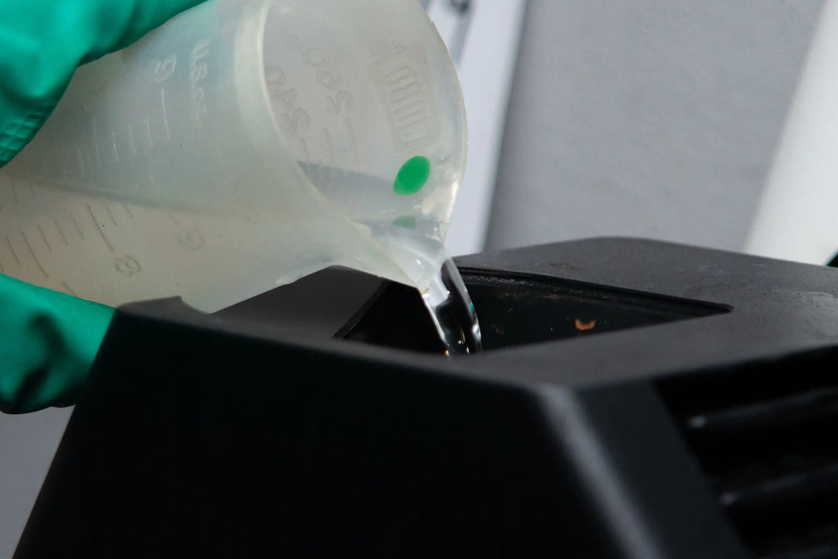 Liquid being poured through the processor funnel at Berlin Photo Studio