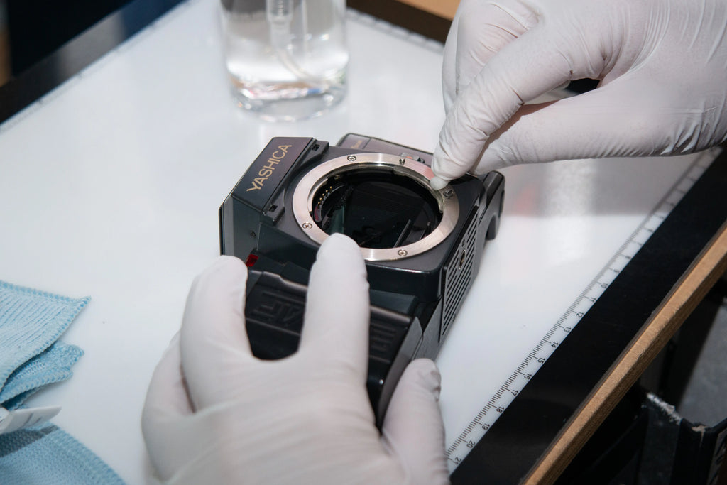 Analog film camera before professional cleaning in Berlin