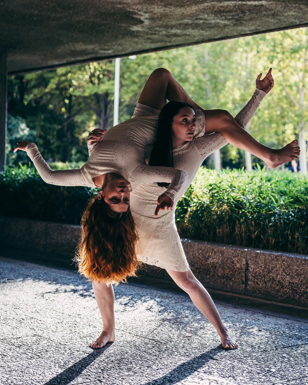 Contemporary dance duo creating a sculptural pose in Berlin