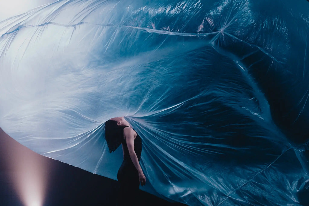 Contemporary dance performance with flowing blue scenography photographed in Berlin