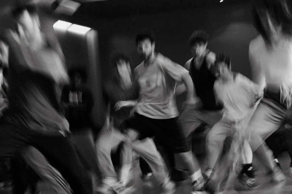 Experimental black and white motion photograph of a dance ensemble