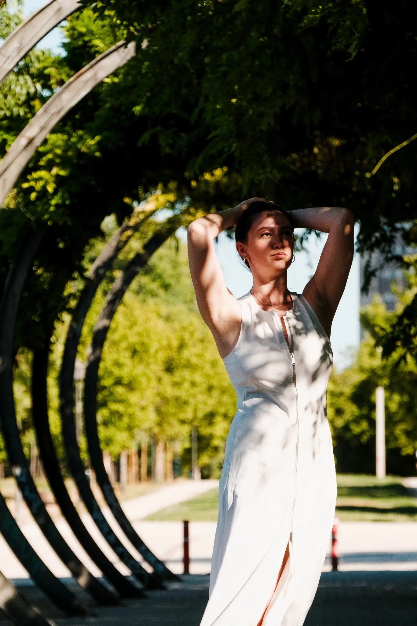 Outdoor dancer portrait using sunlight and architectural forms in Berlin