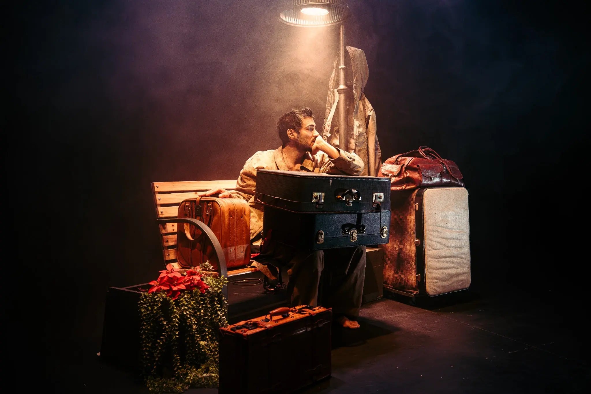 Theatre performance photographed on stage in warm dramatic lighting